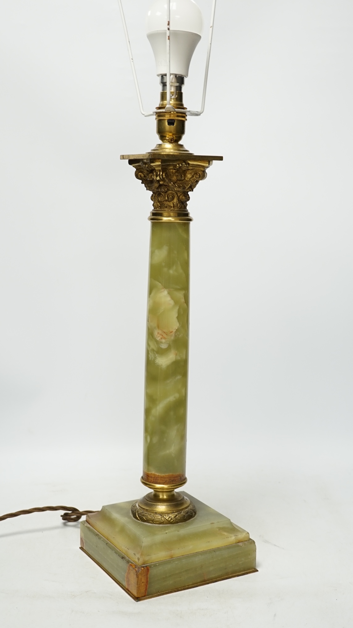 An early 20th century green onyx and brass Corinthian column table lamp, 43cm to top of column. Condition - fair to good, not tested as working